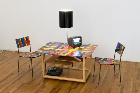 Franz West Creativity: Furniture Reversal, 1998 Two chairs, table, lamp, colored duct tape and video (which colapses into its own crate) 28 1/2 x 38 x 28 in. / 72.4 x 96.5 72.1 cm. (closed dimensions) Edition of 30